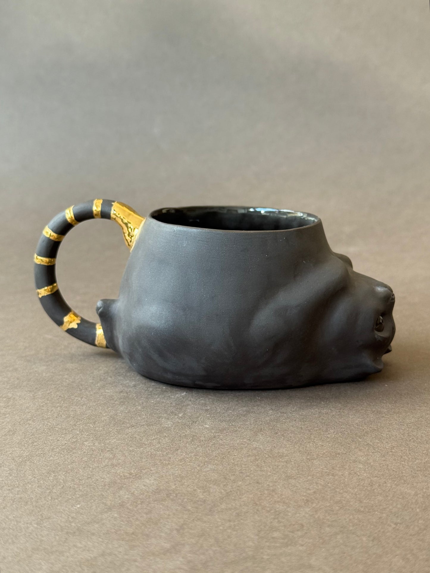 Semi-porcelain Cat with gold striped tail
