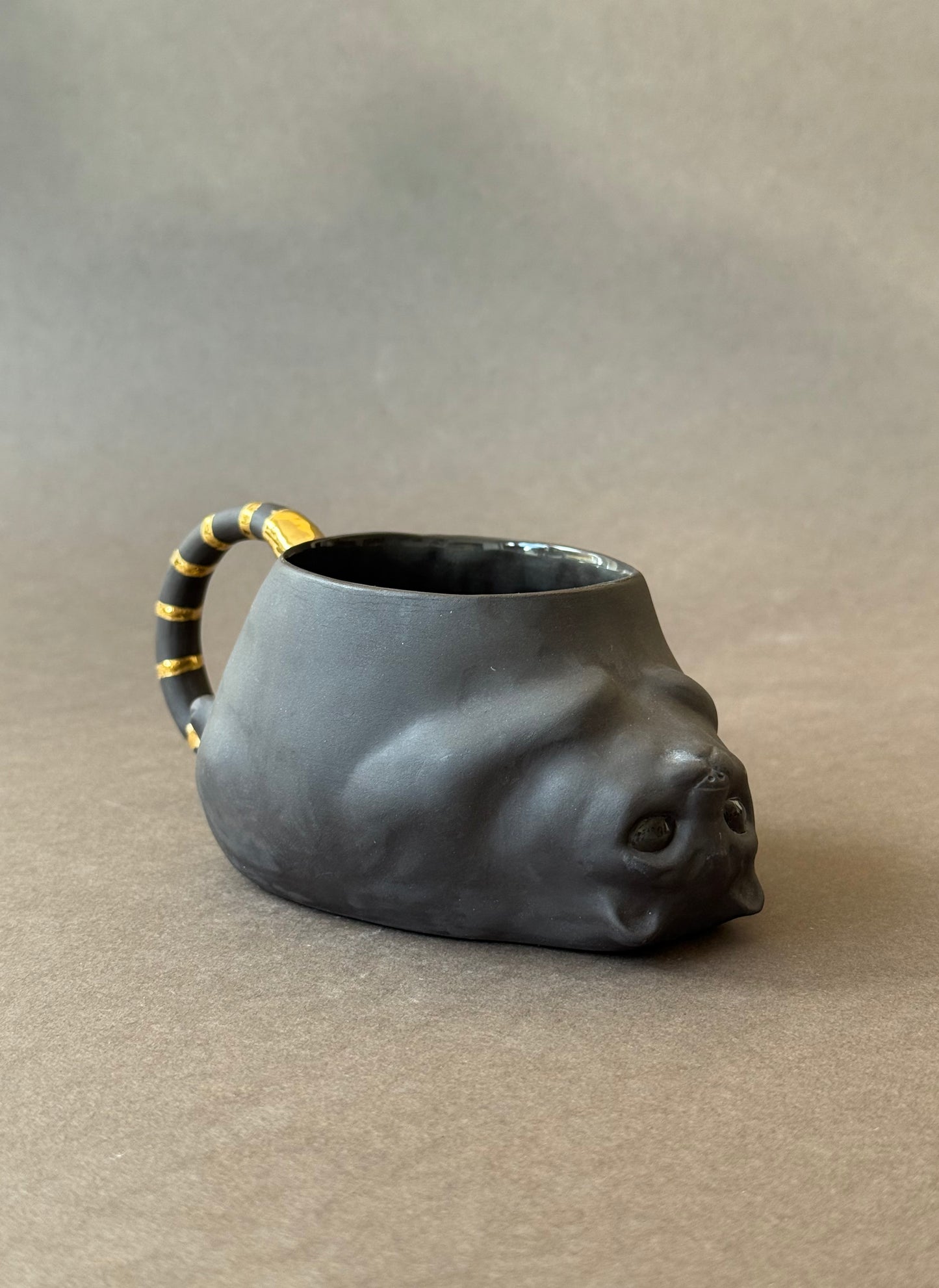 Semi-porcelain Cat with gold striped tail